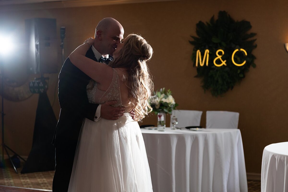 Bride and Groom kissing during first dance at Hampton Inn and Suites Meadowlands, PA