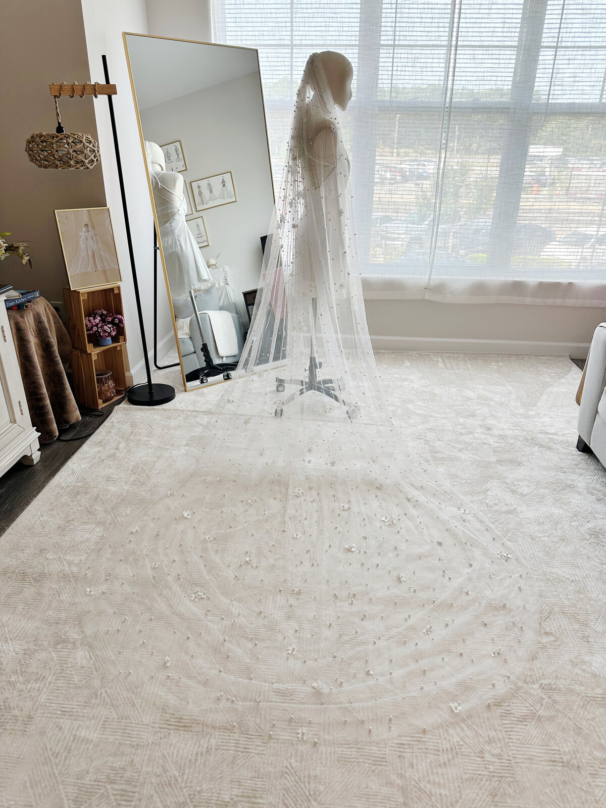 Close-up of hand-sewn beadwork on soft tulle bridal veil
