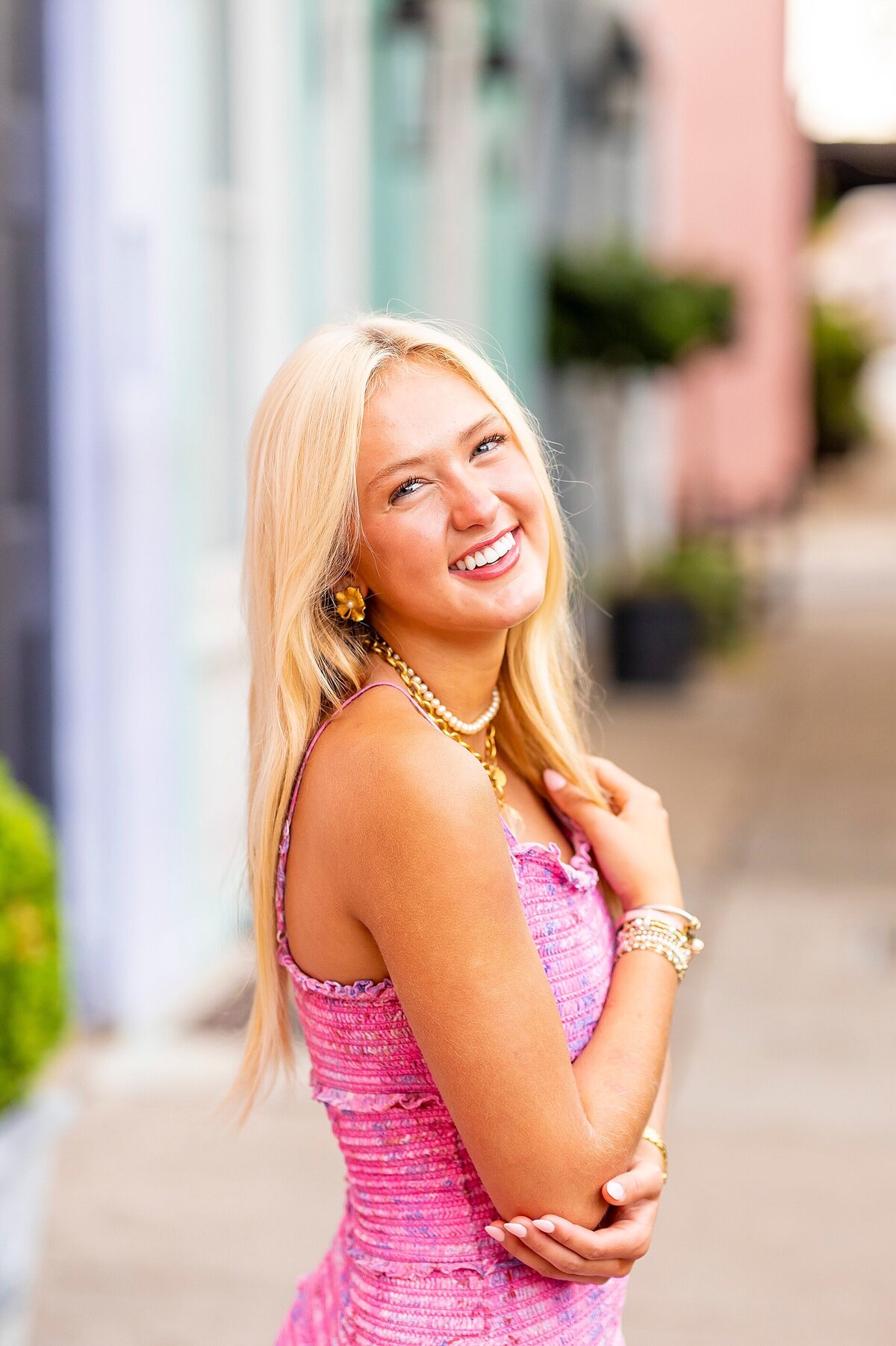Light-filled senior headshot in Charleston highlighting authenticity and joyful personality