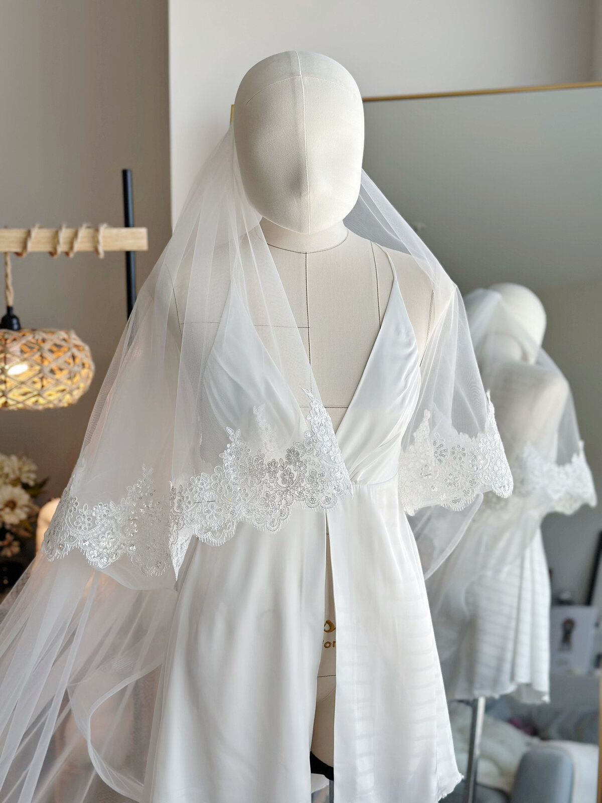 Dreamy lace blusher veil layered over classic updo
