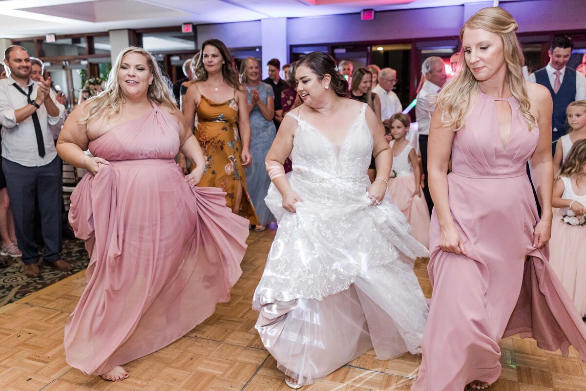 bride-and-bridesmaids-dancing