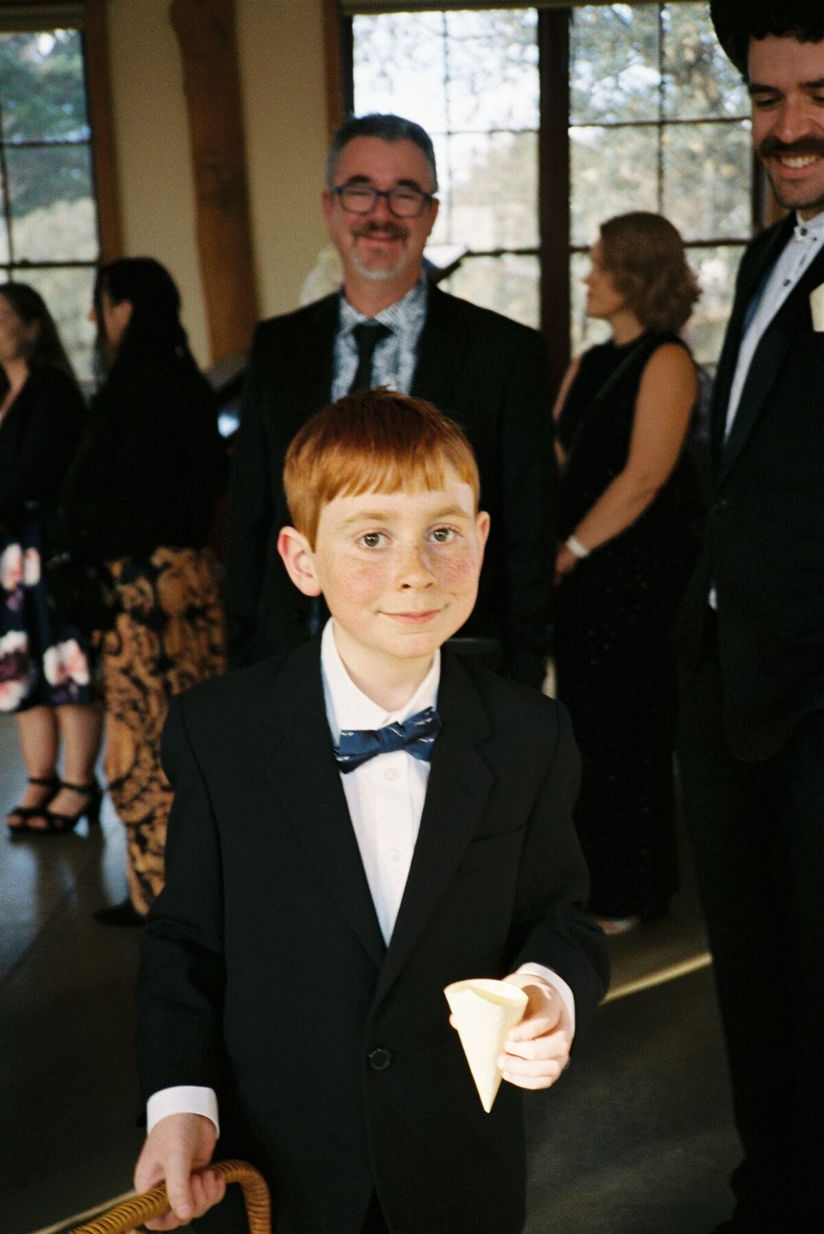 page boy ready for ceremony at shearing shed wedding venue 35mm film