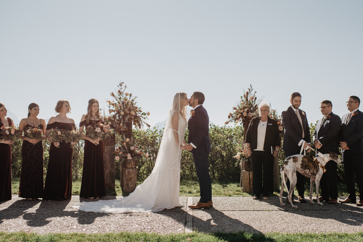 Photographers Jackson Hole capture couple kissing at wedding ceremony