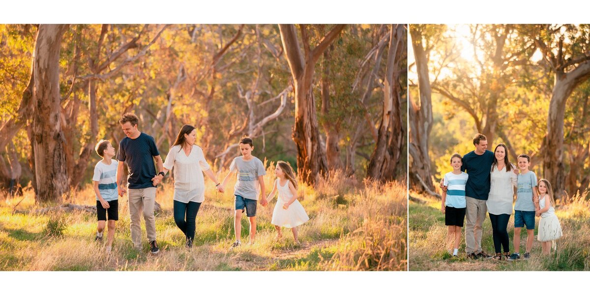 Family photographer Hampton Roads va captures a fall family photos with parents holding hands with their children as they walk through a grassy field with a grove of trees behind them