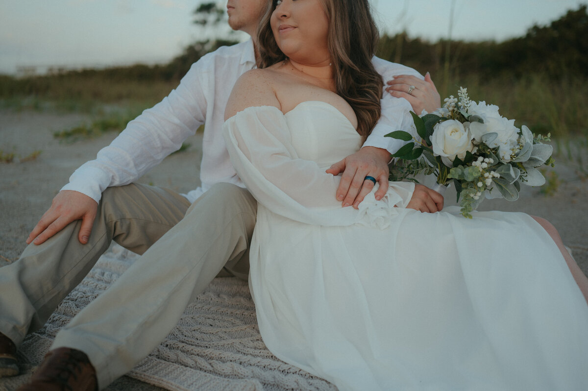 couple sitting down during wedding day