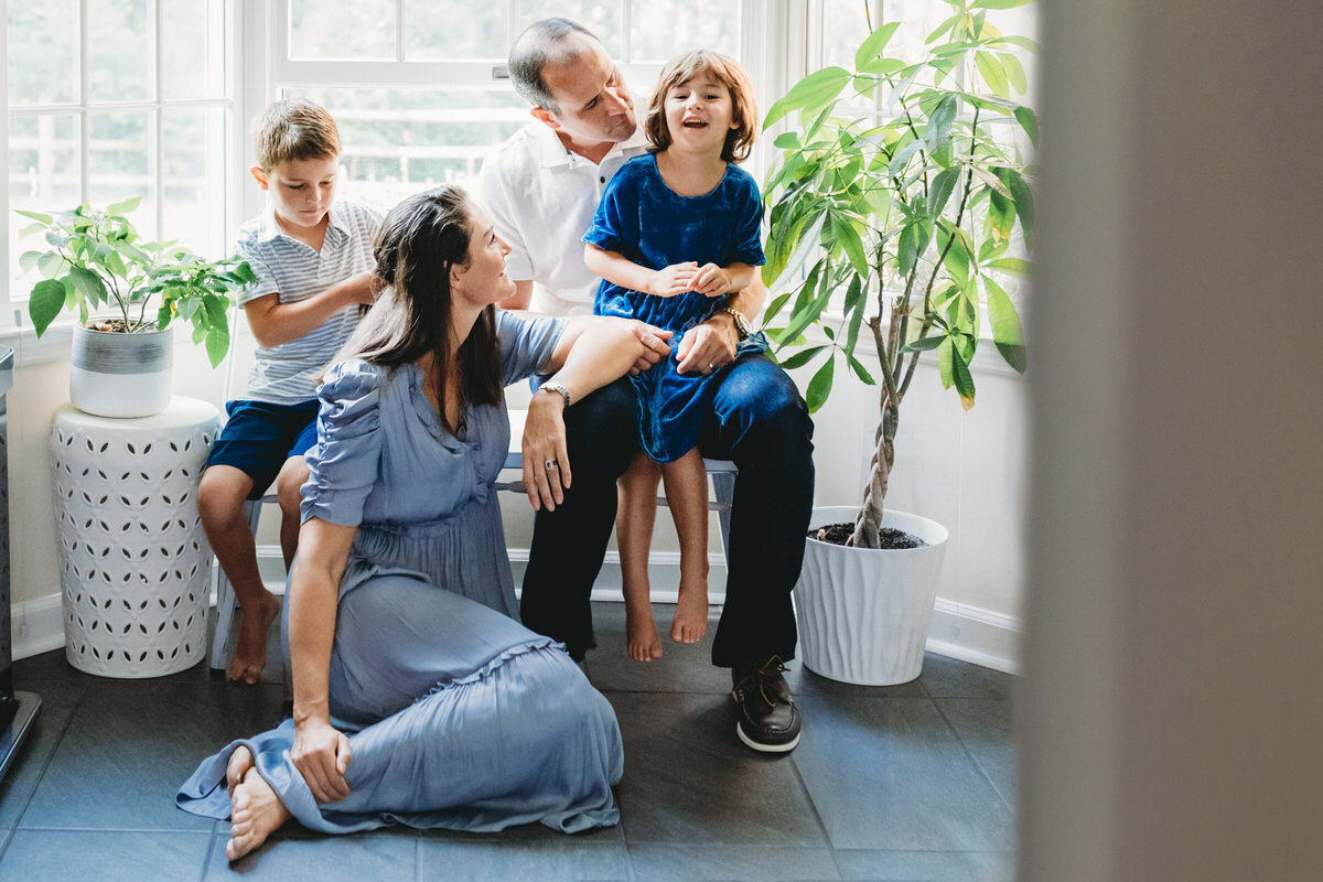 family sitting together inside