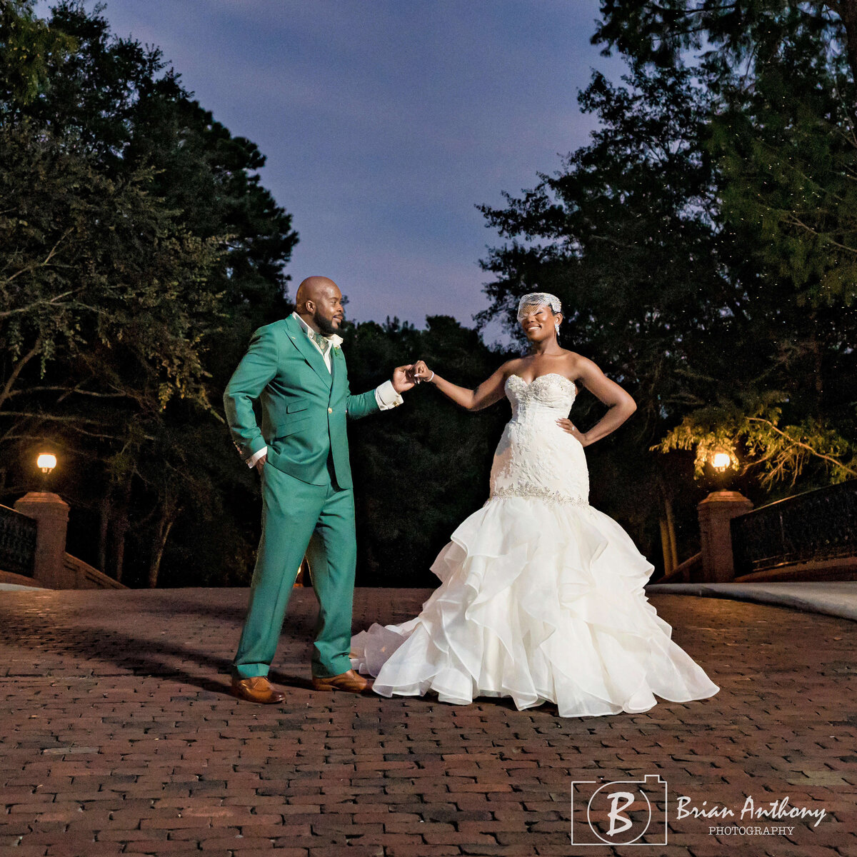 Romantic sunset wedding portrait featuring the bride and groom in a timeless pose.