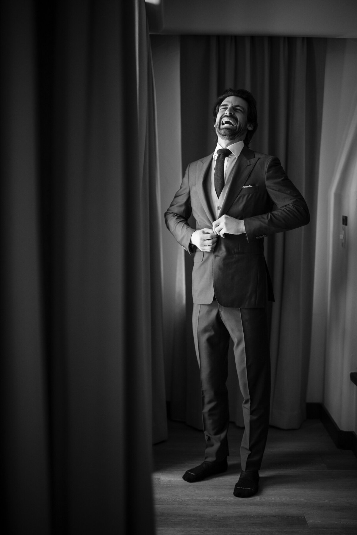 A groom gets ready at a destination wedding at Nestldown in Los Gatos, California