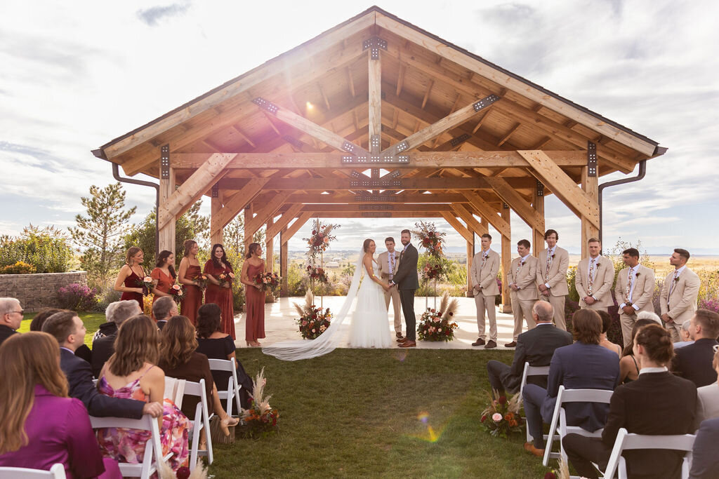Bride, groom, and guests during  a wedding ceremony at Bonnie Blues Event Venue.
