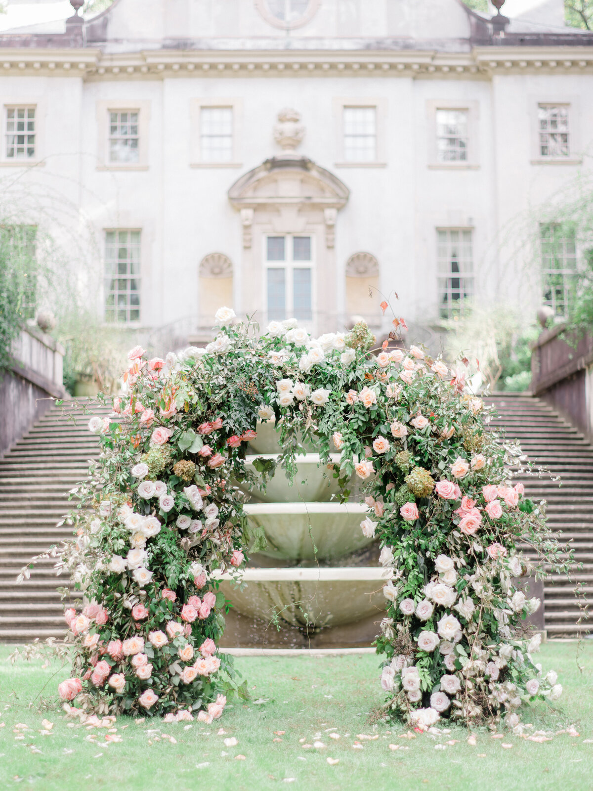 Ceremony floral arbor installation