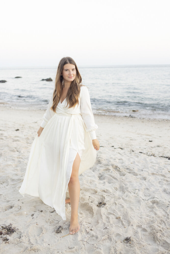 beautiful woman in white dress on the beach