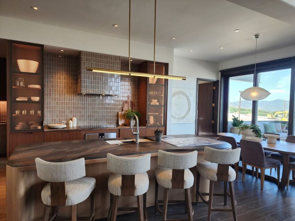 Modern kitchen with layered lighting and warm wood tones