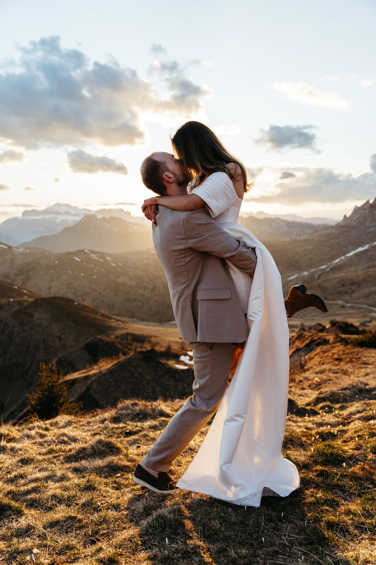 happy couple during sunset in Dolomites