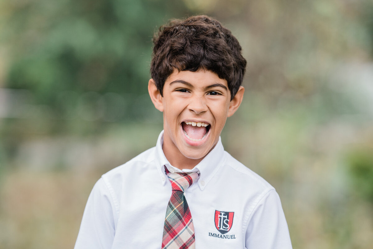 school-portrait-of-an-extremely-happy-boy