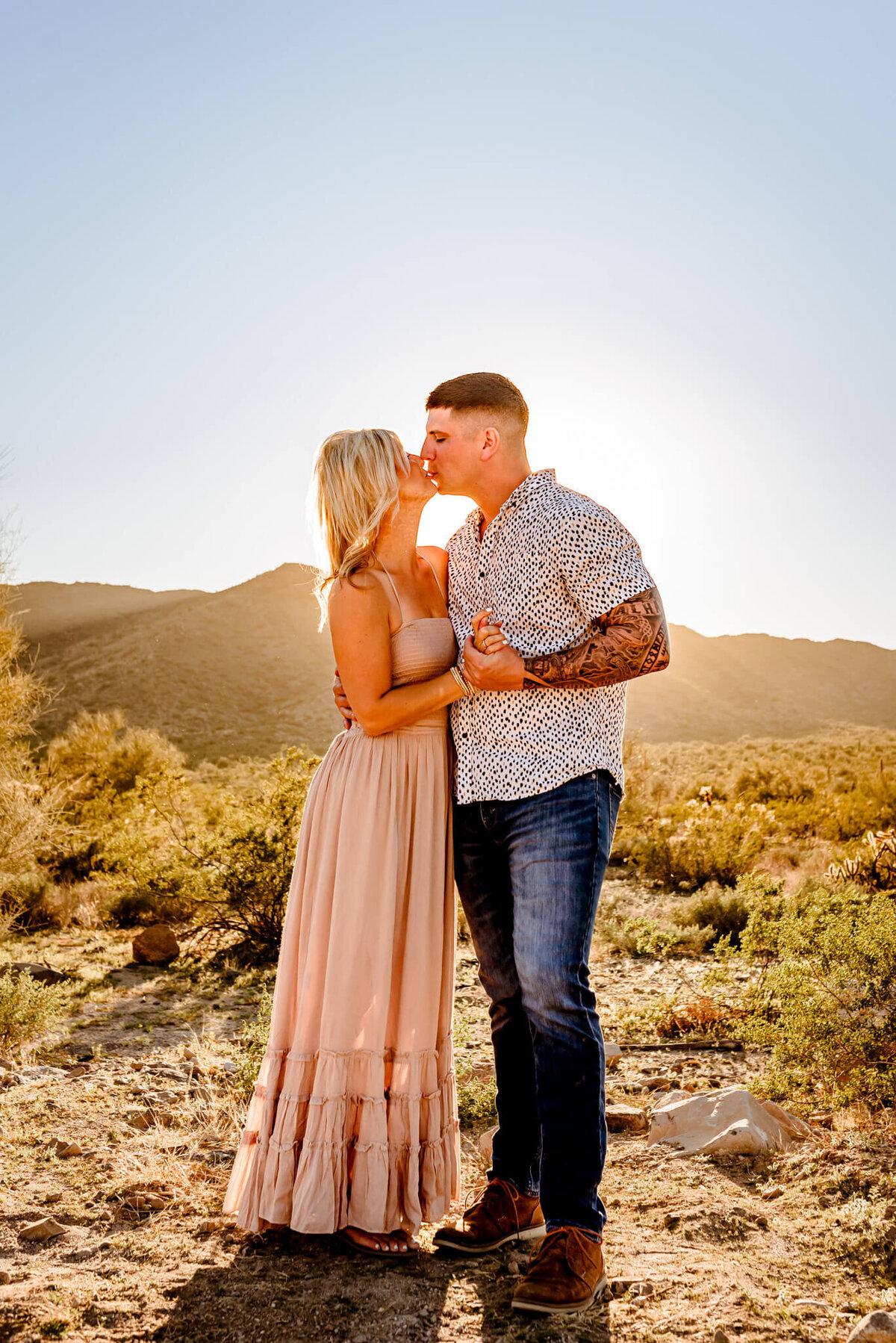 couple kissing during family photography session in Arizona