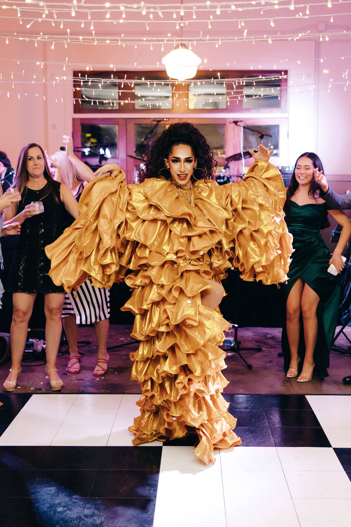 Drag queen performs at a wedding reception.