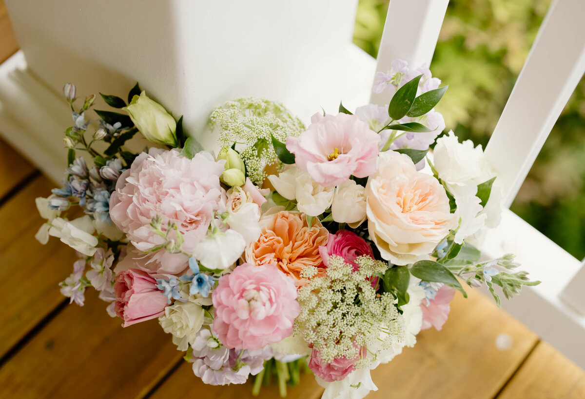 Colorful floral arrangement designed by Abby Grace Florals at NC wedding