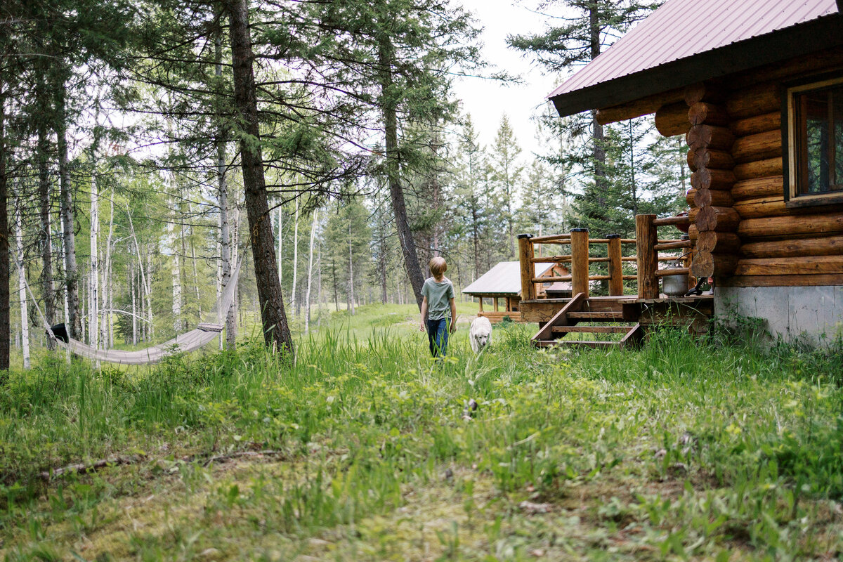 boy walking with a dog