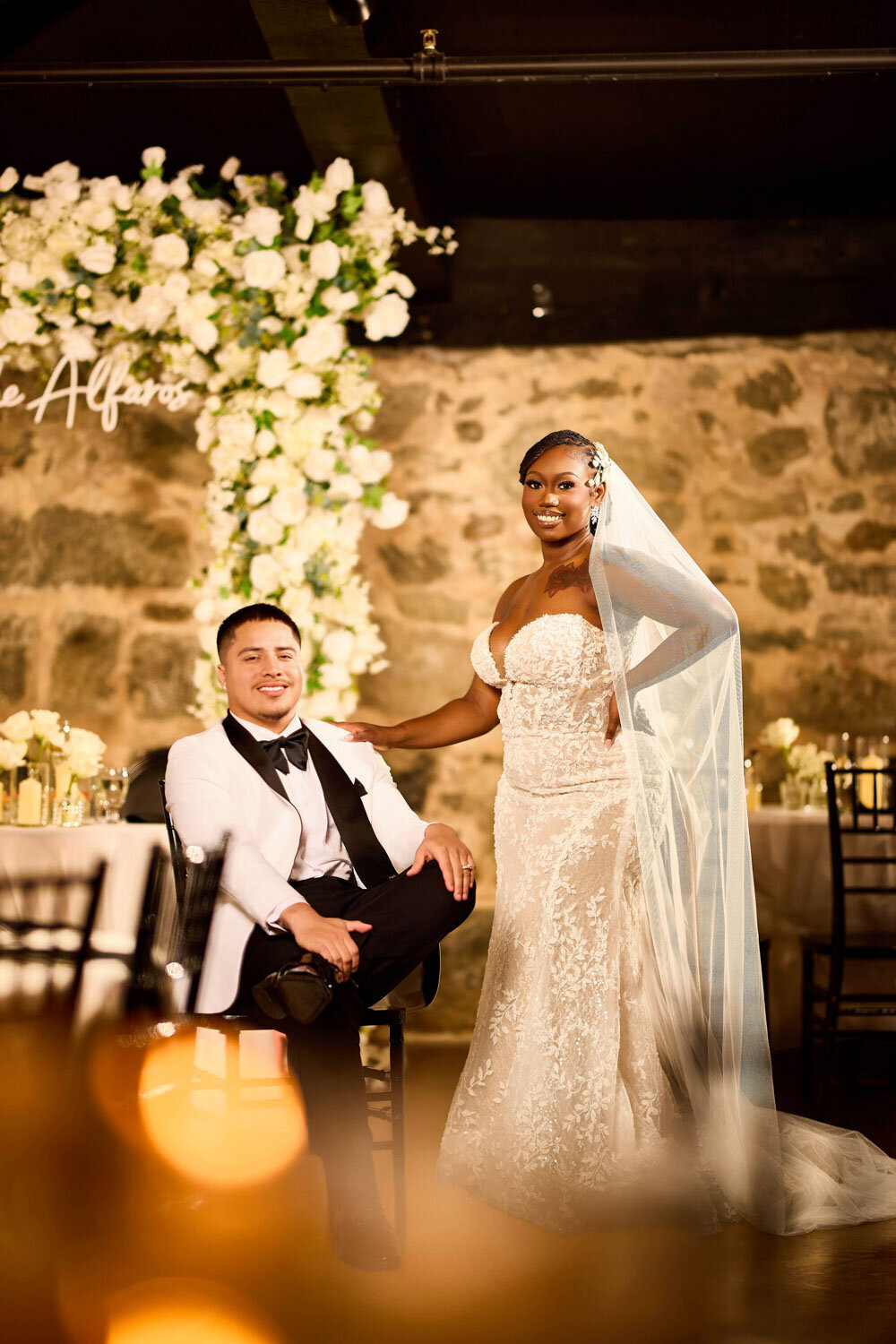 Bride and groom pose for wedding photoshoot