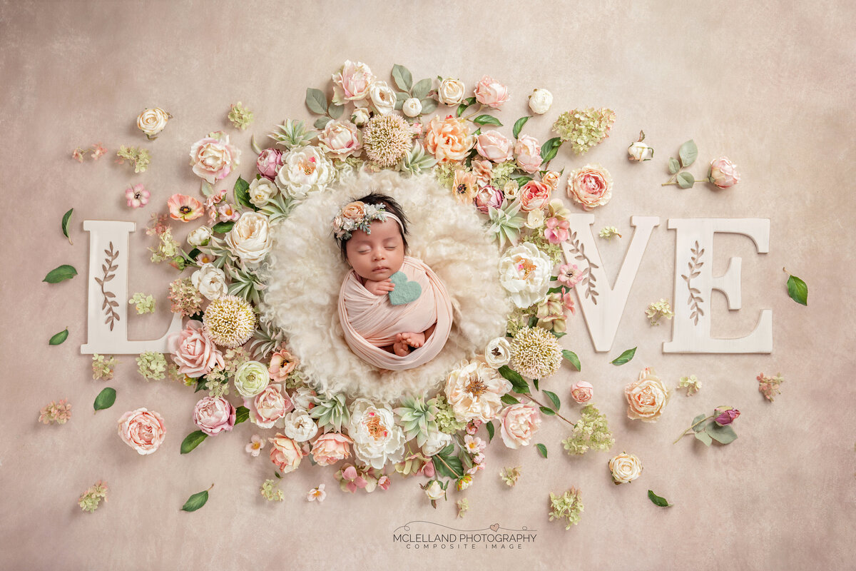 newborn-baby-girl-love-floral-wreath-flatlay
