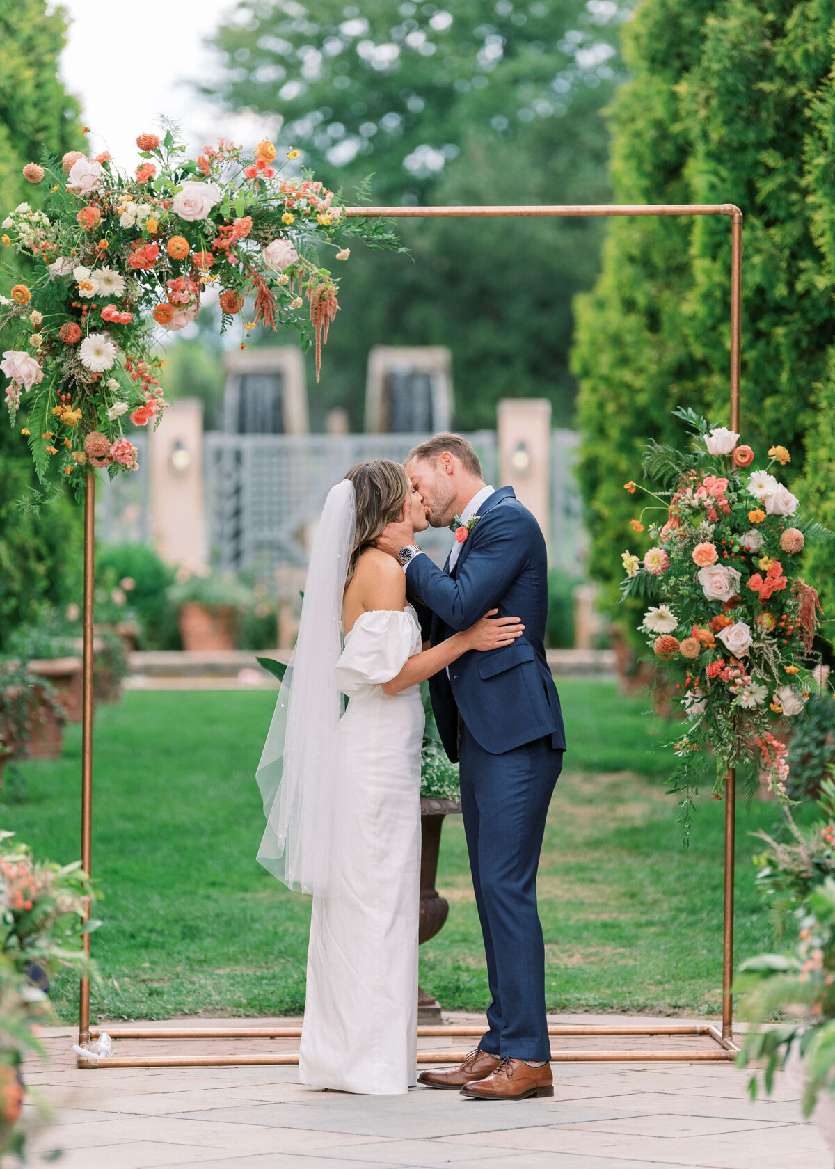 Finally - the first kiss of the new bride and groom! Image taken by Virginia Wedding Photographer