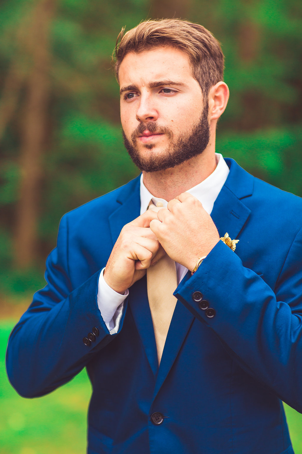 Wedding Photograph Of Man in Blue Suit Fixing his Necktie Los Angeles