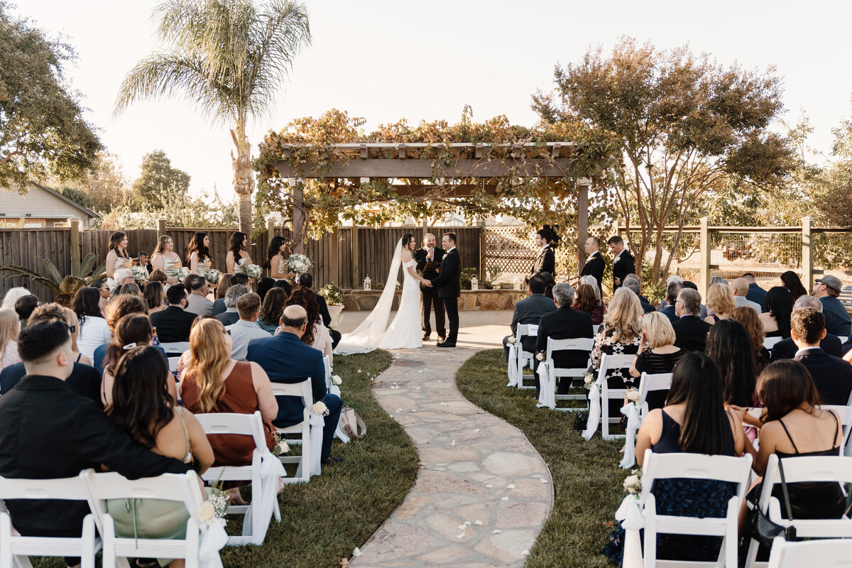 bride and groom stand during wedding ceremony