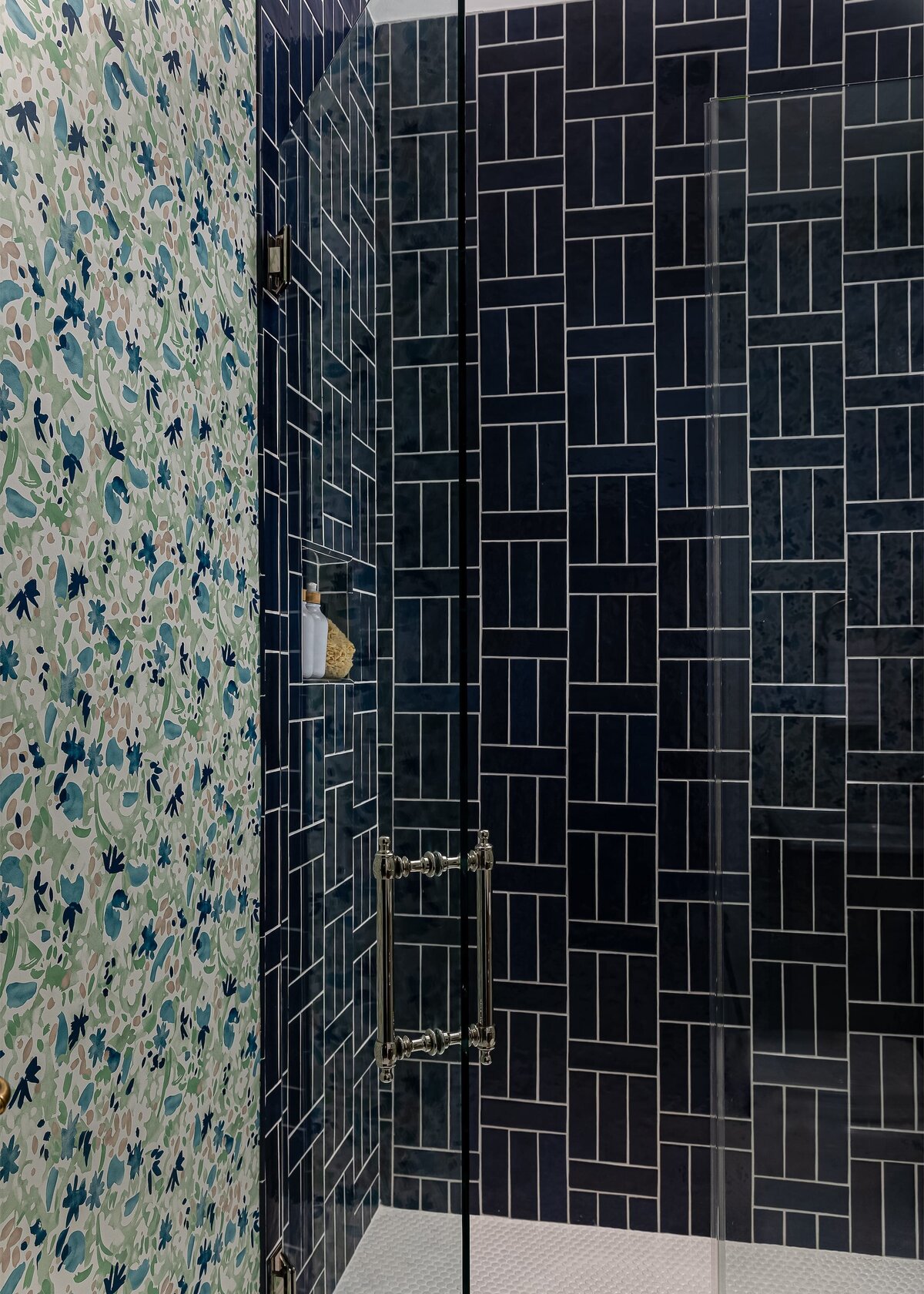 melinda chesson interiors carriage house bathroom dark blue titled shower