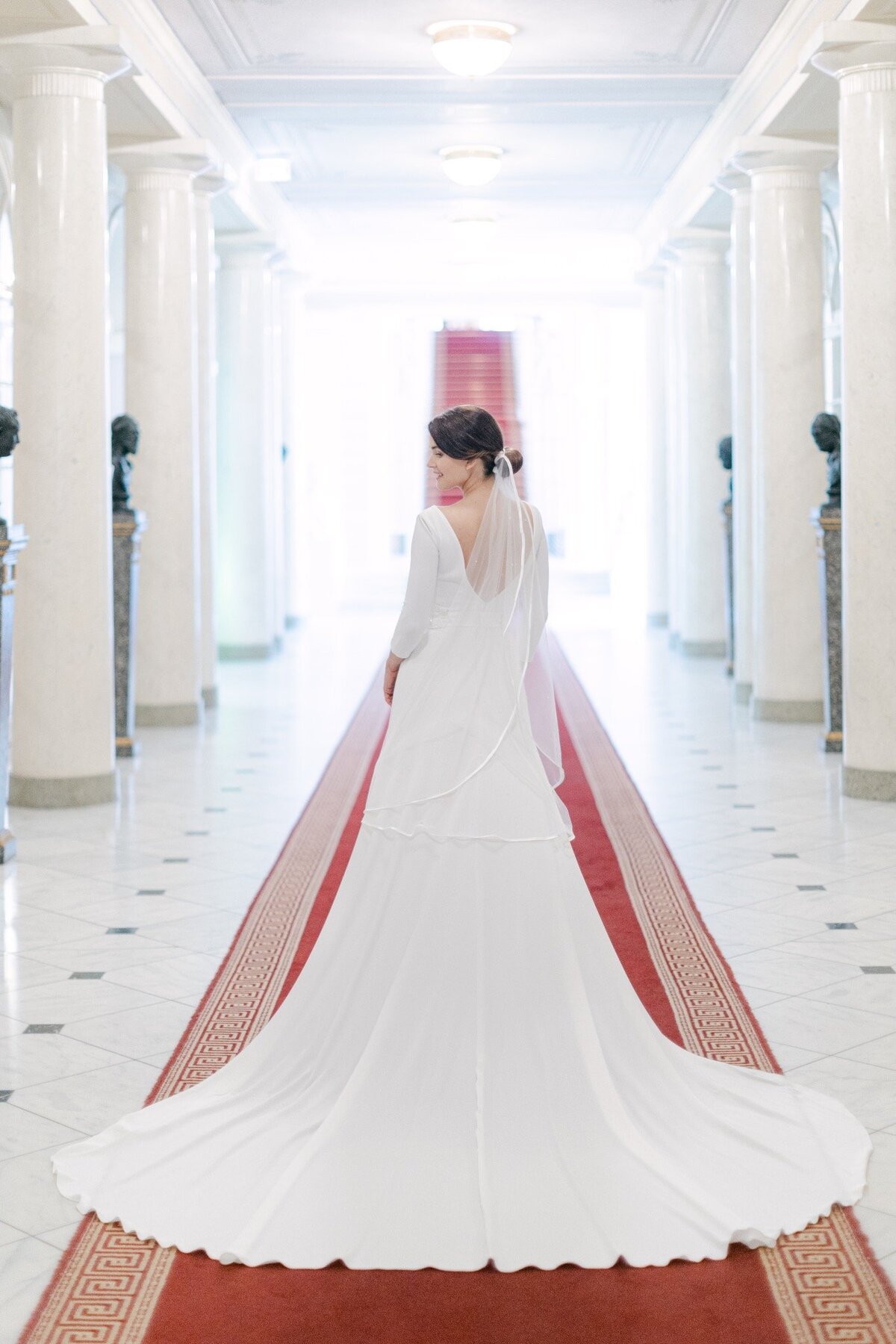 ECLAT Destination Bride walking down the hallway to the ceremony 