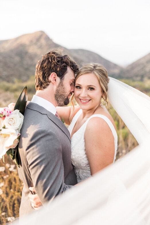 bride and groom at a Mission Trails wedding with flying veil