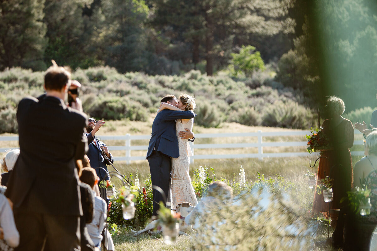 Ali and Brian embrace one another during their vintage elopement in California.