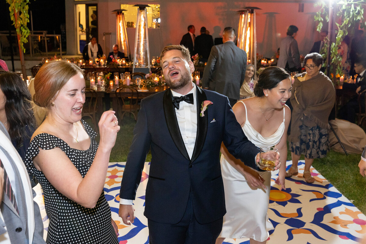 Bride and groom dancing and singing