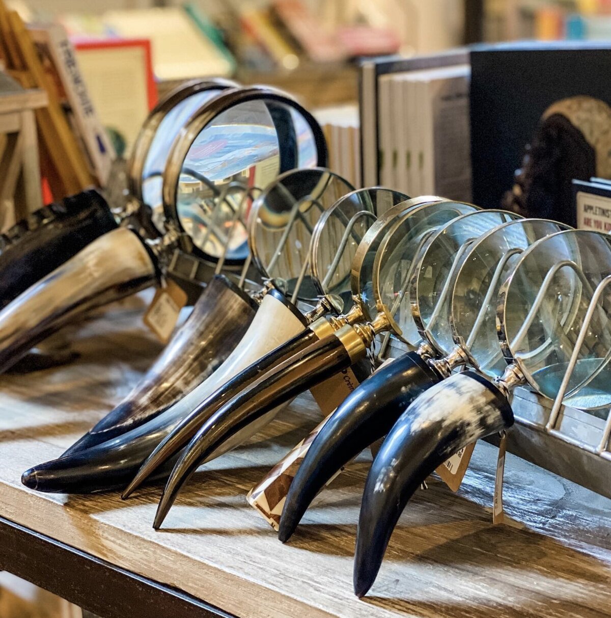 vintage magnifying glasses with horn handles in a stack