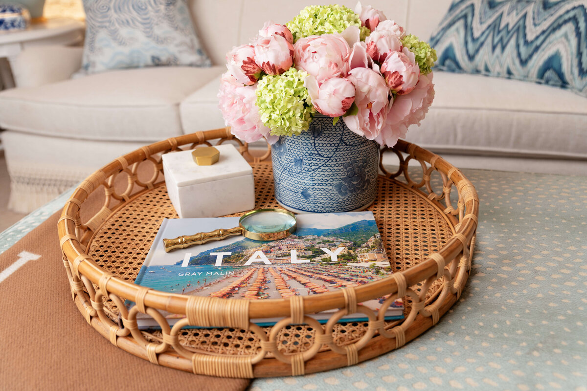kristin ashley interiors styled coffee table with wicker tray and flowers