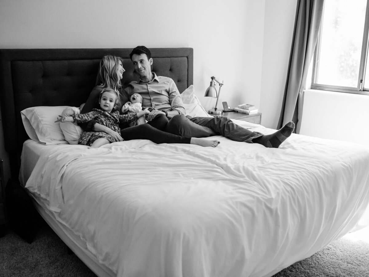 family photo in master bedroom for in home lifestyle photoshoot
