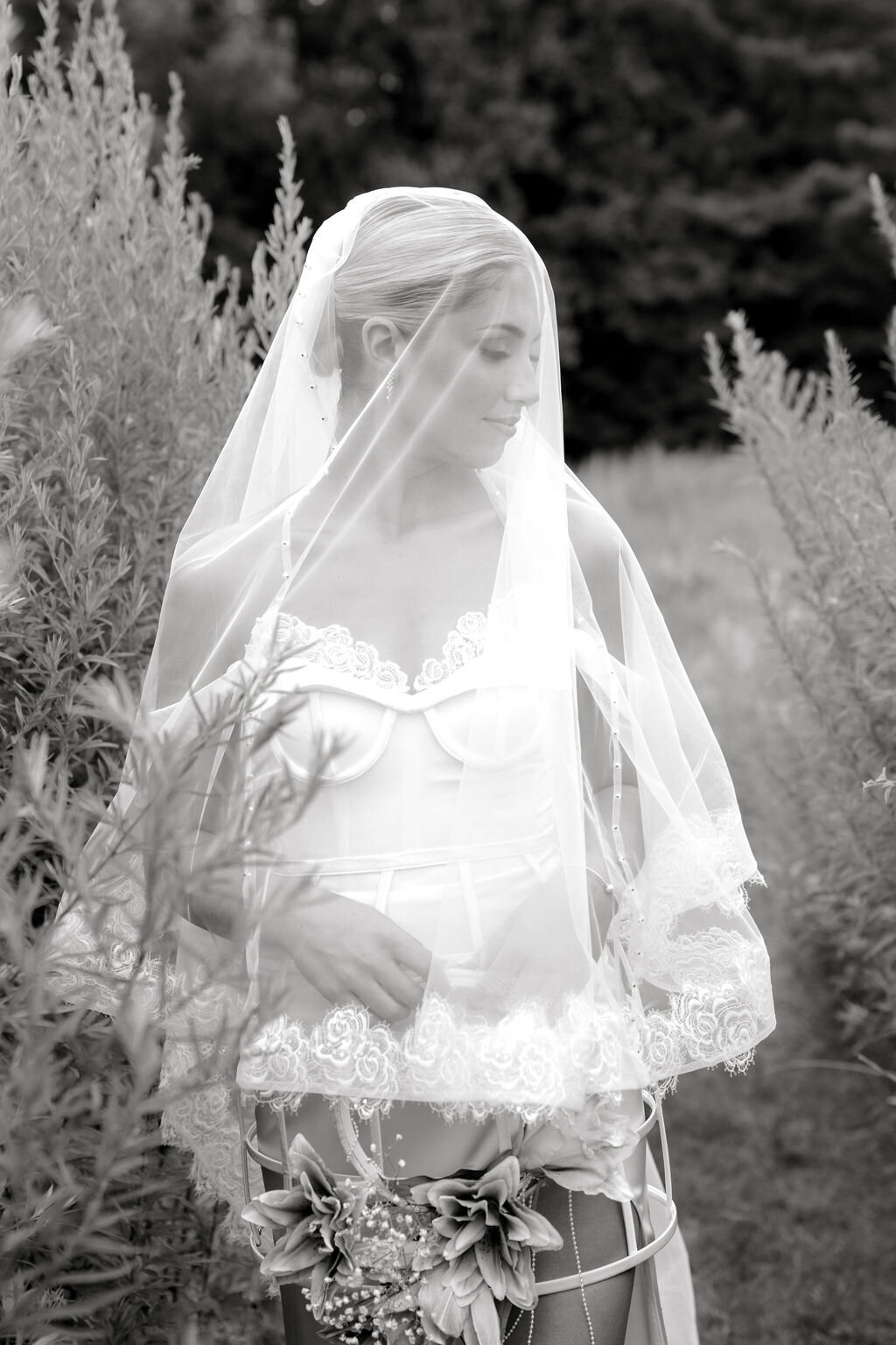 Custom bridal dress with detachable crinoline cage and lace blusher veil
