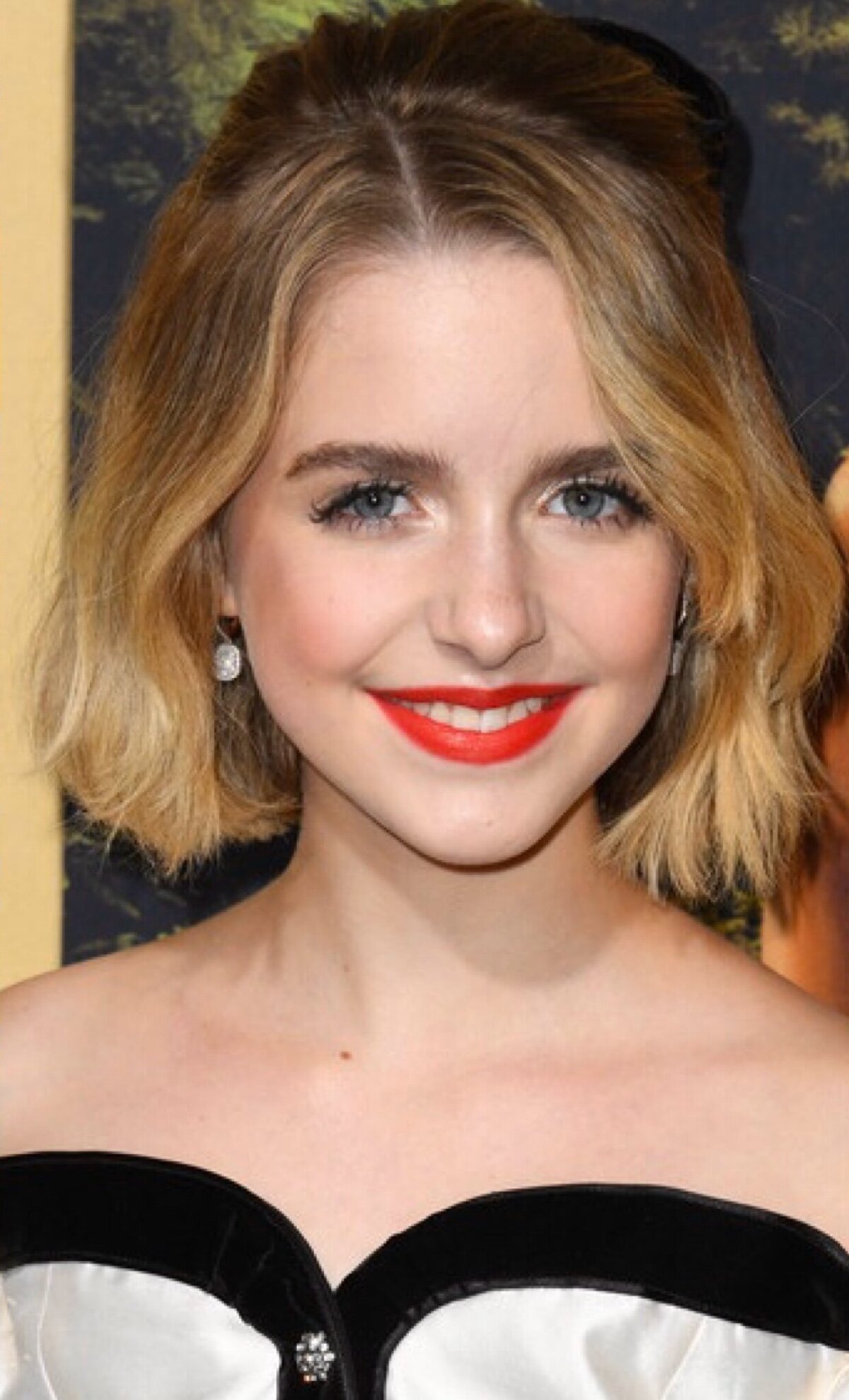 McKenna Grace in a red lip and long white dress
