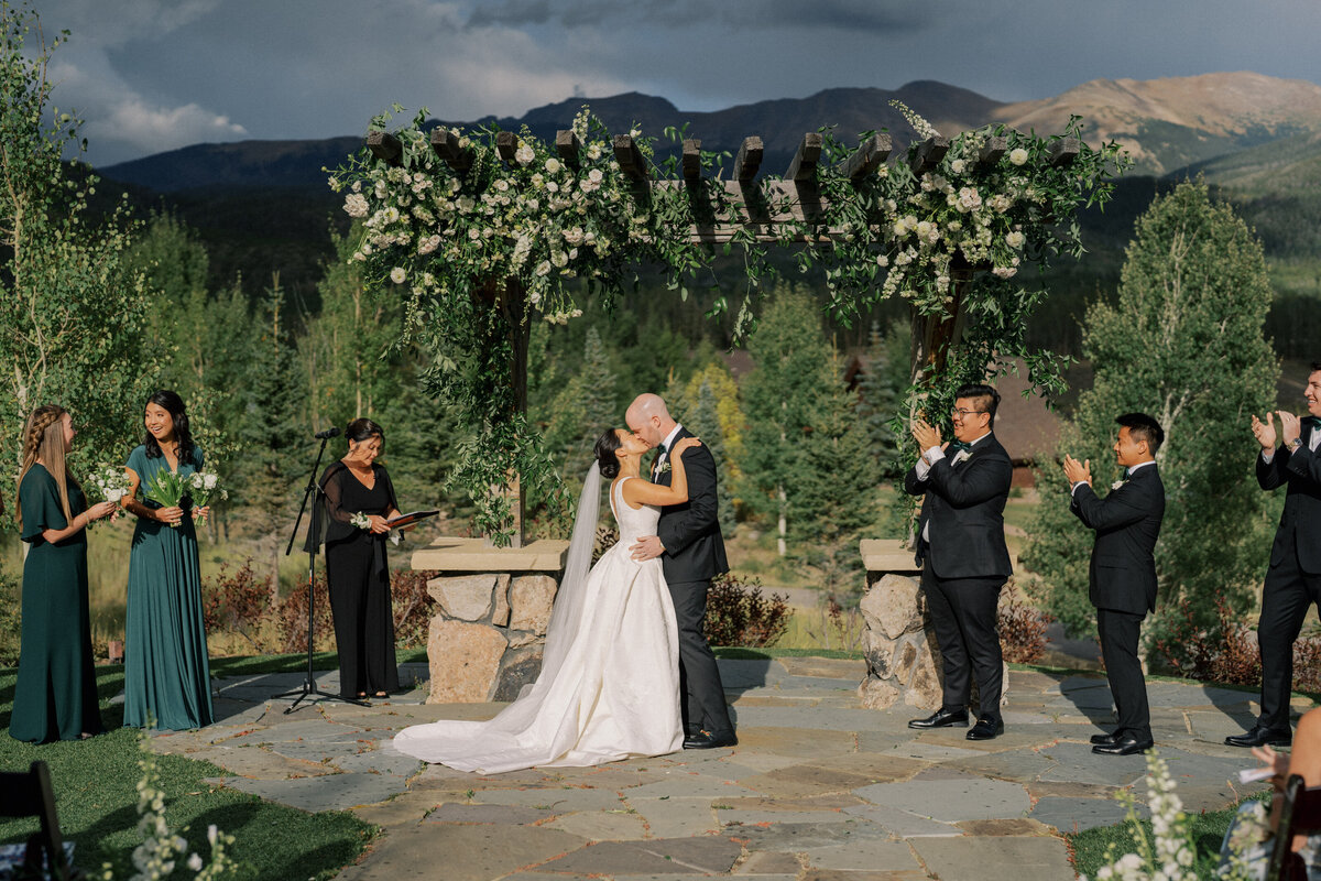 Ceremony kiss at Devils Thumb Ranch Colorado wedding