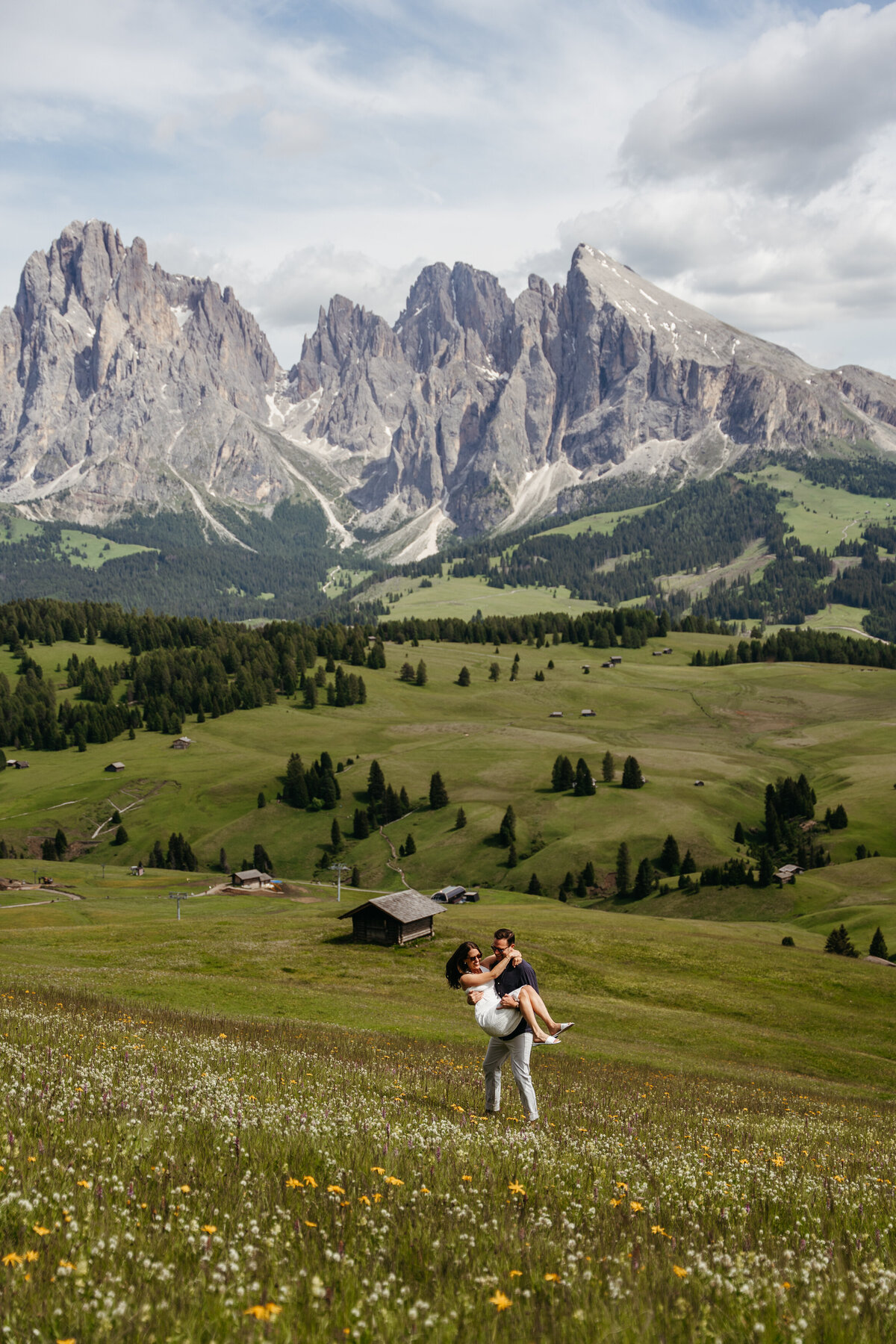 sweet couple intimate Alpe di Siusi mountain meadow view