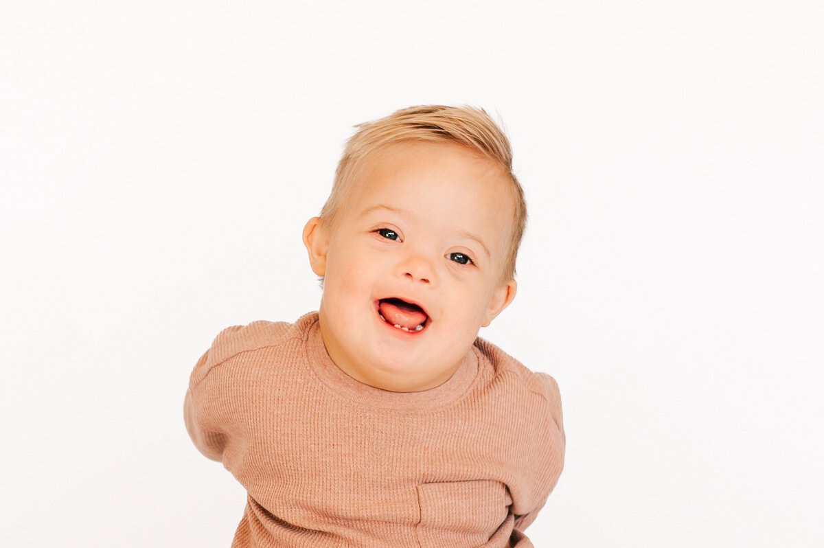 down syndrome kids photo of close up of baby boy smiling