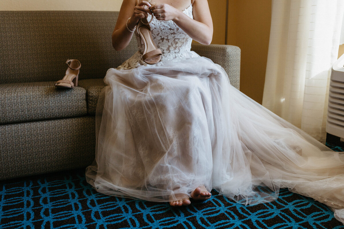 bride-putting-shoes-on