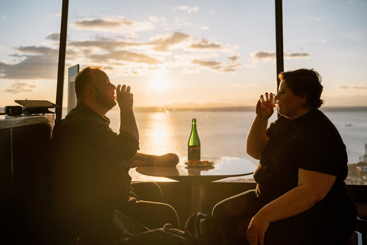 Couple sits down for a drink at the top of the space needle