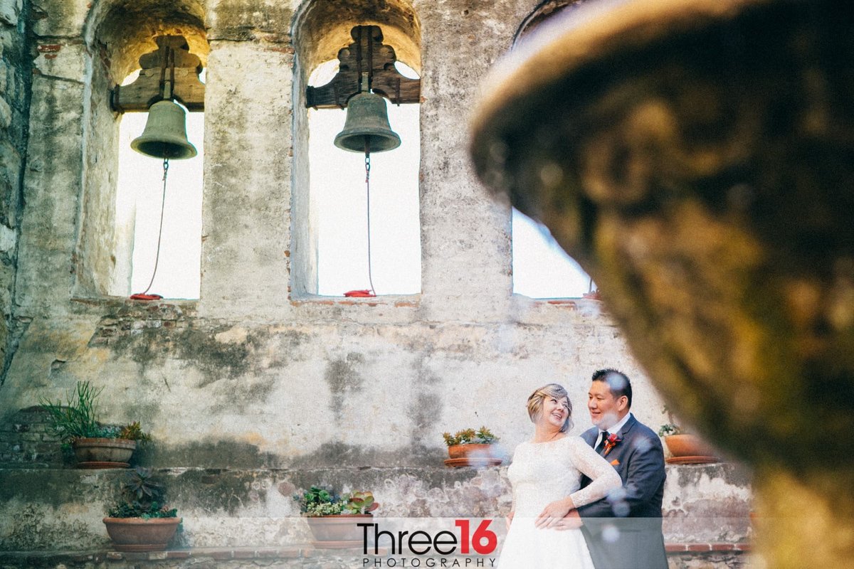 Bride looks back at her Groom during the photo shoot