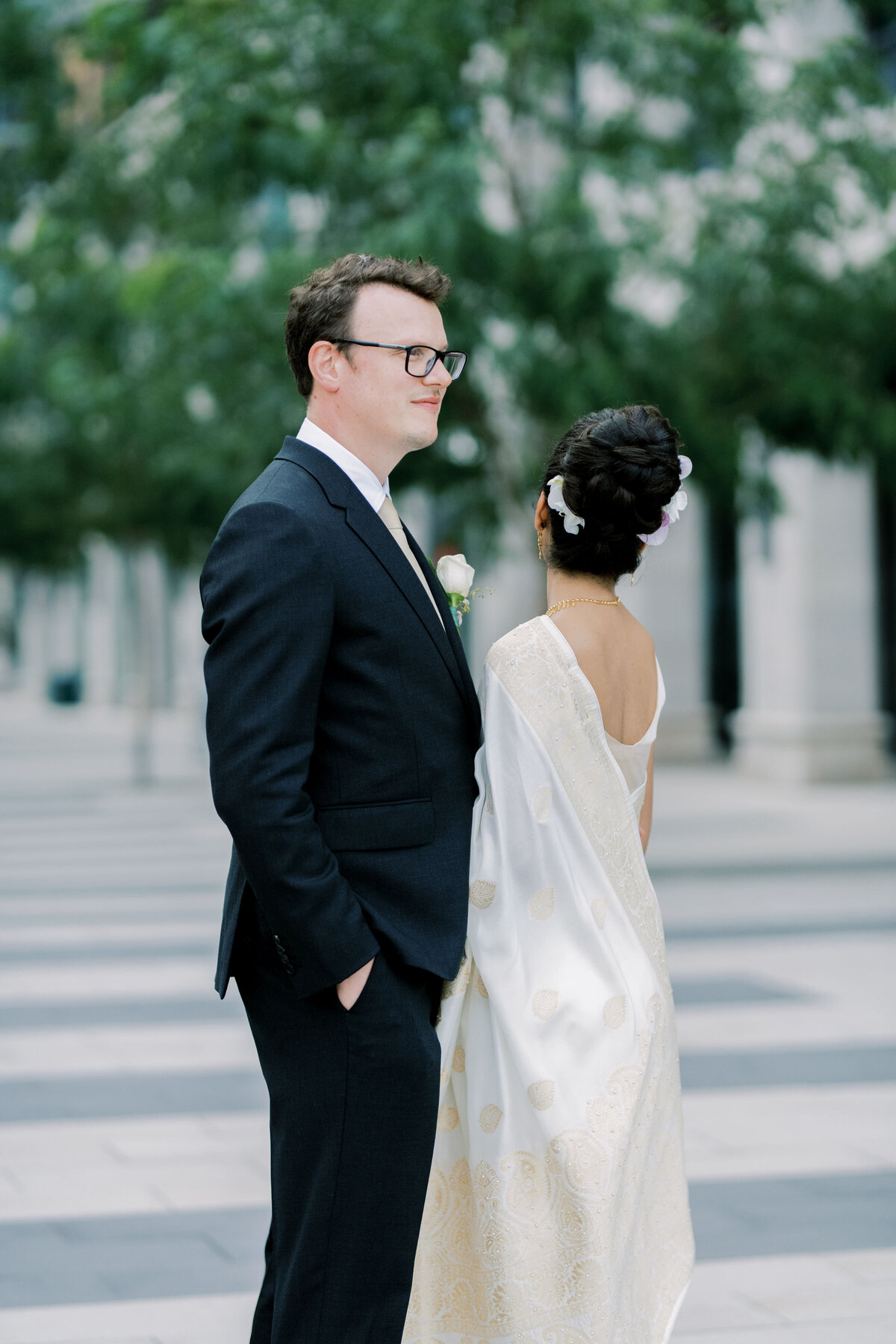 bride and groom sharing a moment together outside in the courtyard at the pearle hotel