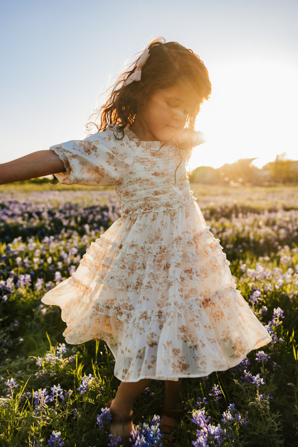 girl-spins-in-bluebonnets