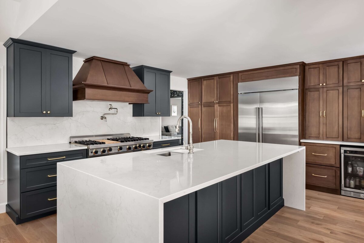 Modern kitchen renovation with custom cabinetry and quartz countertops by Rosewood Building & Design.