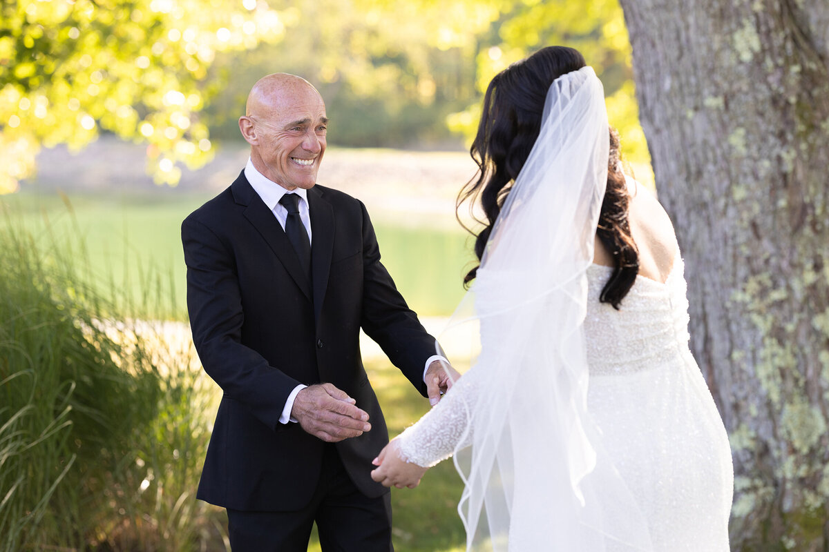 Bride and her father share a first look during golden hour. Wedding at Sun Valley in Chagrin Falls, Ohio. Photographed by wedding photographer in Cleveland Aaron Aldhizer