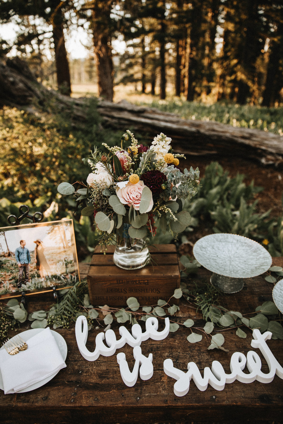 Tahoe Wedding Planners eucalyptus burgundy and white flowers at summer wedding venue Mitchell's Mountain Meadows Sierraville near Truckee, Joy of Life Events image by Lukas Koryn 2