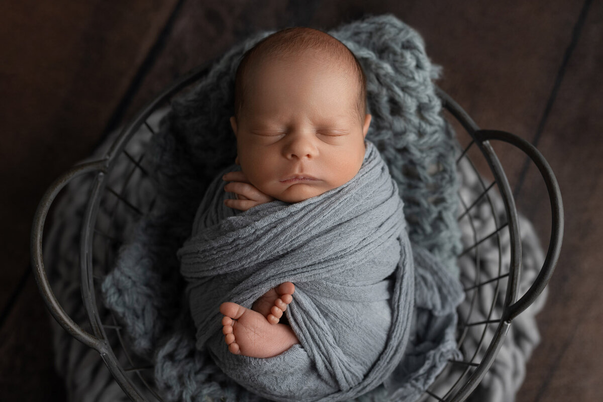 Newborn baby boy blue wrap Liberty Hill professional family photographer