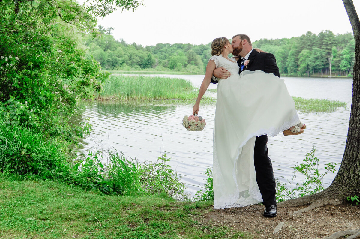 Groom carrying bride at Rollinsford New Hampshire wedding